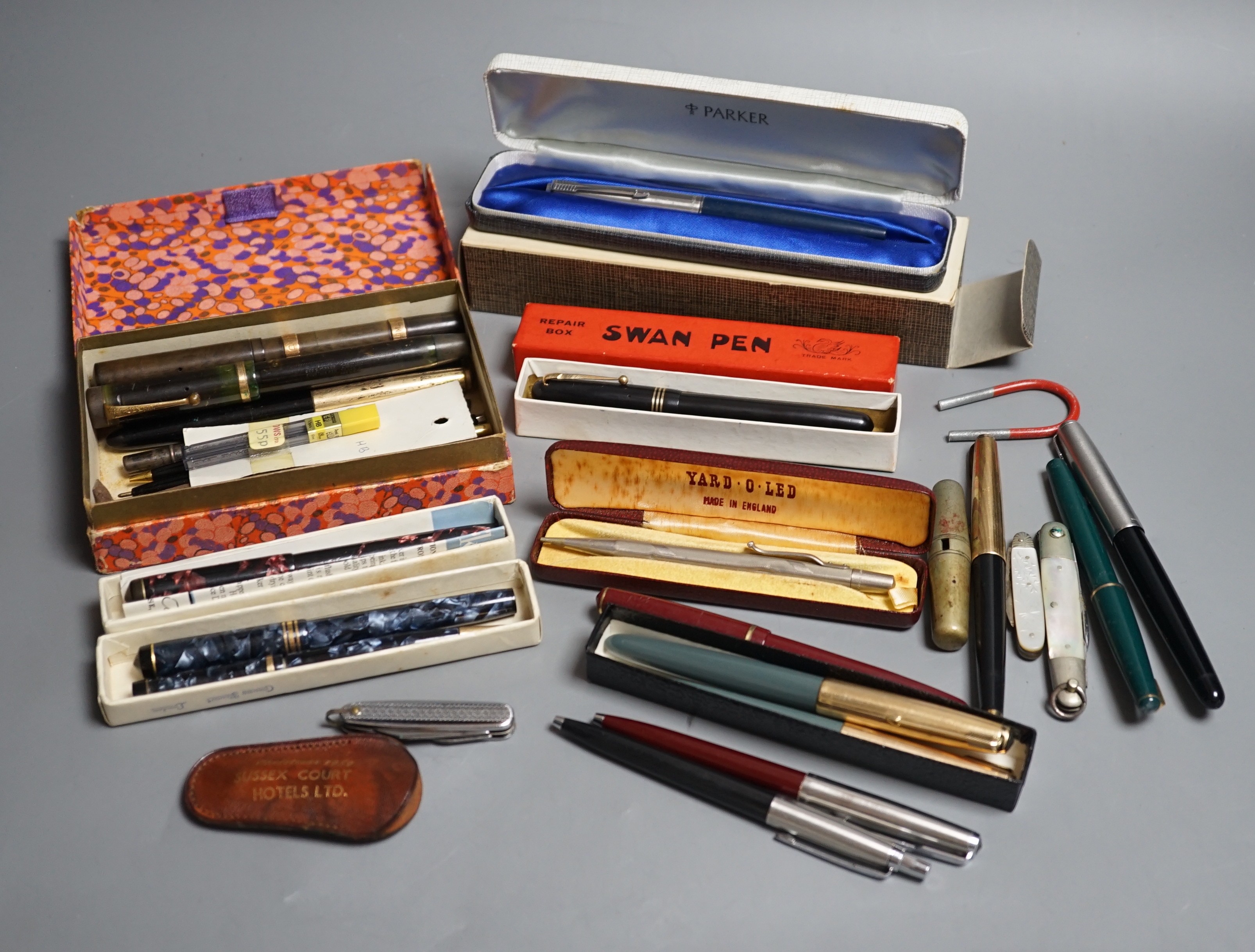A group of fountain pens and pencils including a Waterman's ideal gold mounted pen